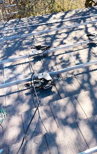 Roof showing inverter mounts and heavy shading